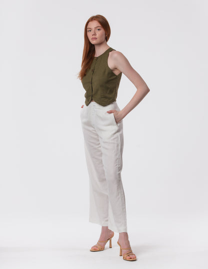 Model wearing high-waisted wide-leg linen pants in white with a relaxed fit and tailored waist by Artemizelle