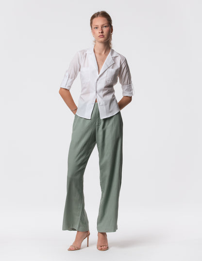 Model wearing high-waisted wide-leg linen pants in Green with a relaxed fit and tailored waist by Artemizelle