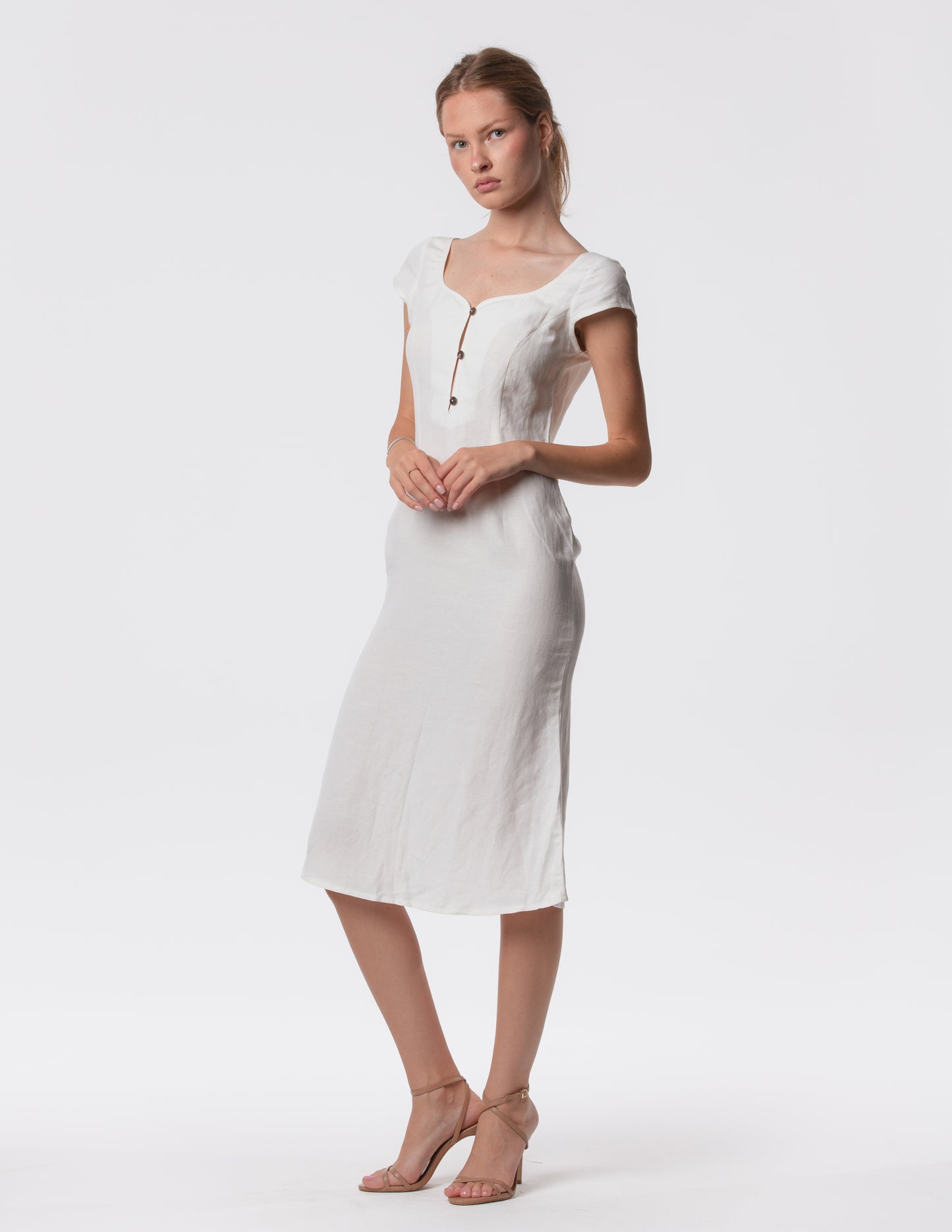 Minimalist linen midi dress close up sweetheart neckline in white. Elevated Elegance